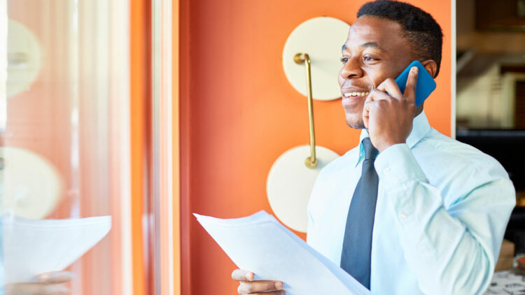 business man smiling on phone