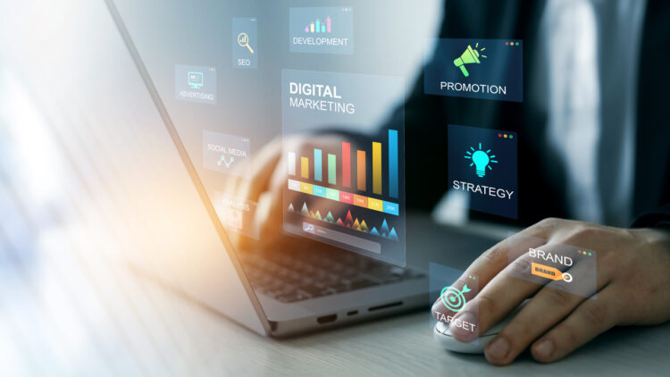 person typing on laptop doing marketing