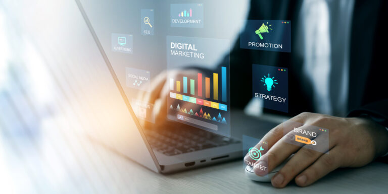 person typing on laptop doing marketing